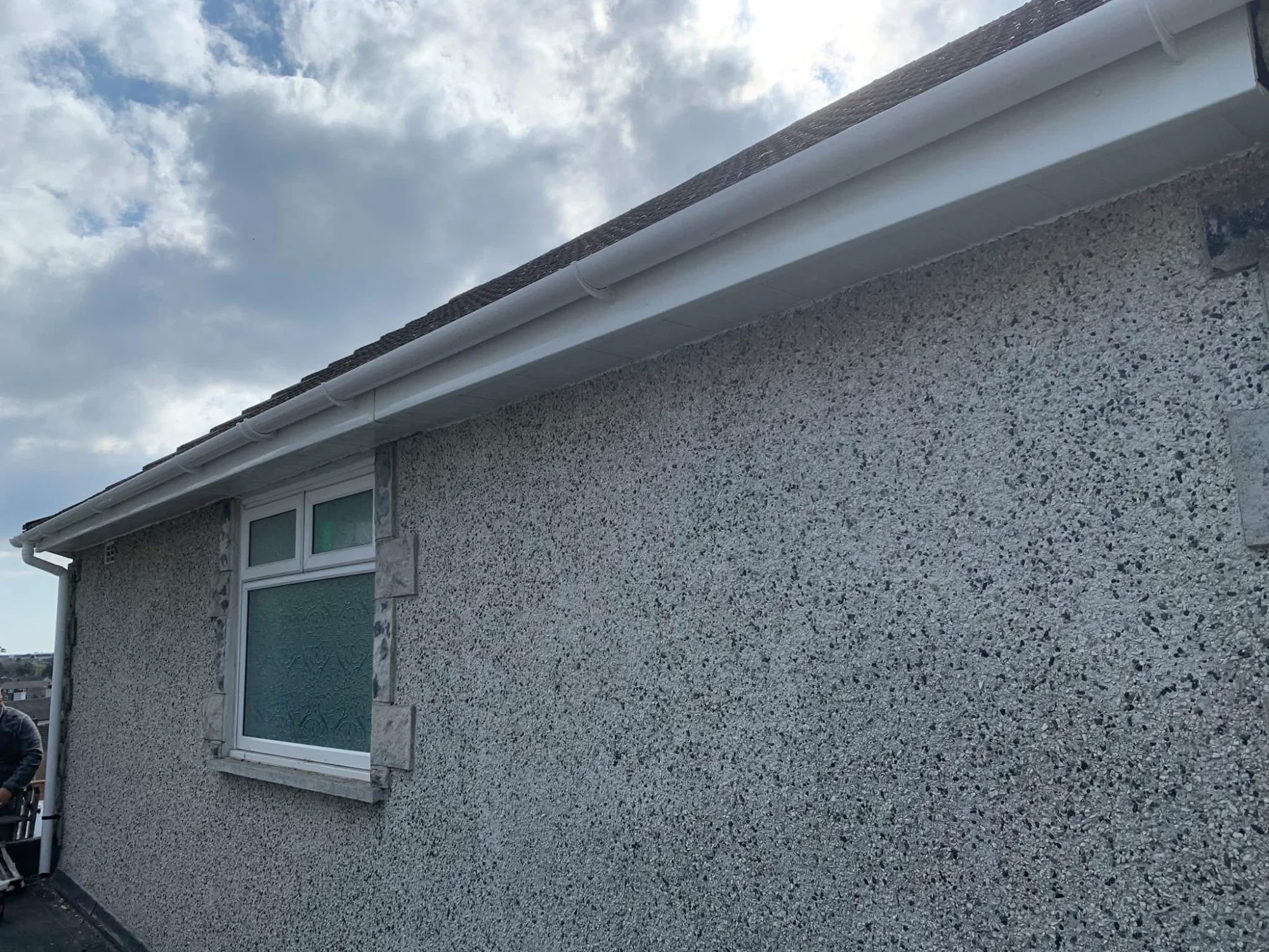 Fascia and guttering replacement project - new uPVC roofline with seamless finish and properly pitched guttering